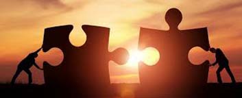 People Joining Puzzle Pieces Together